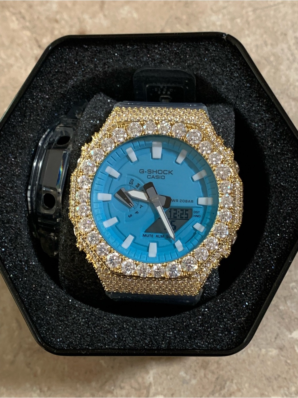 Casio G-Shock Blue Dial Watch with Gold Crystal Bezel